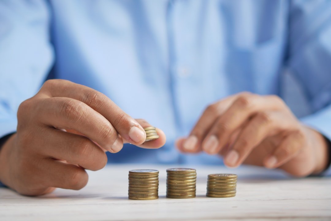 Stacking coins representing UK pension and SIPP savings